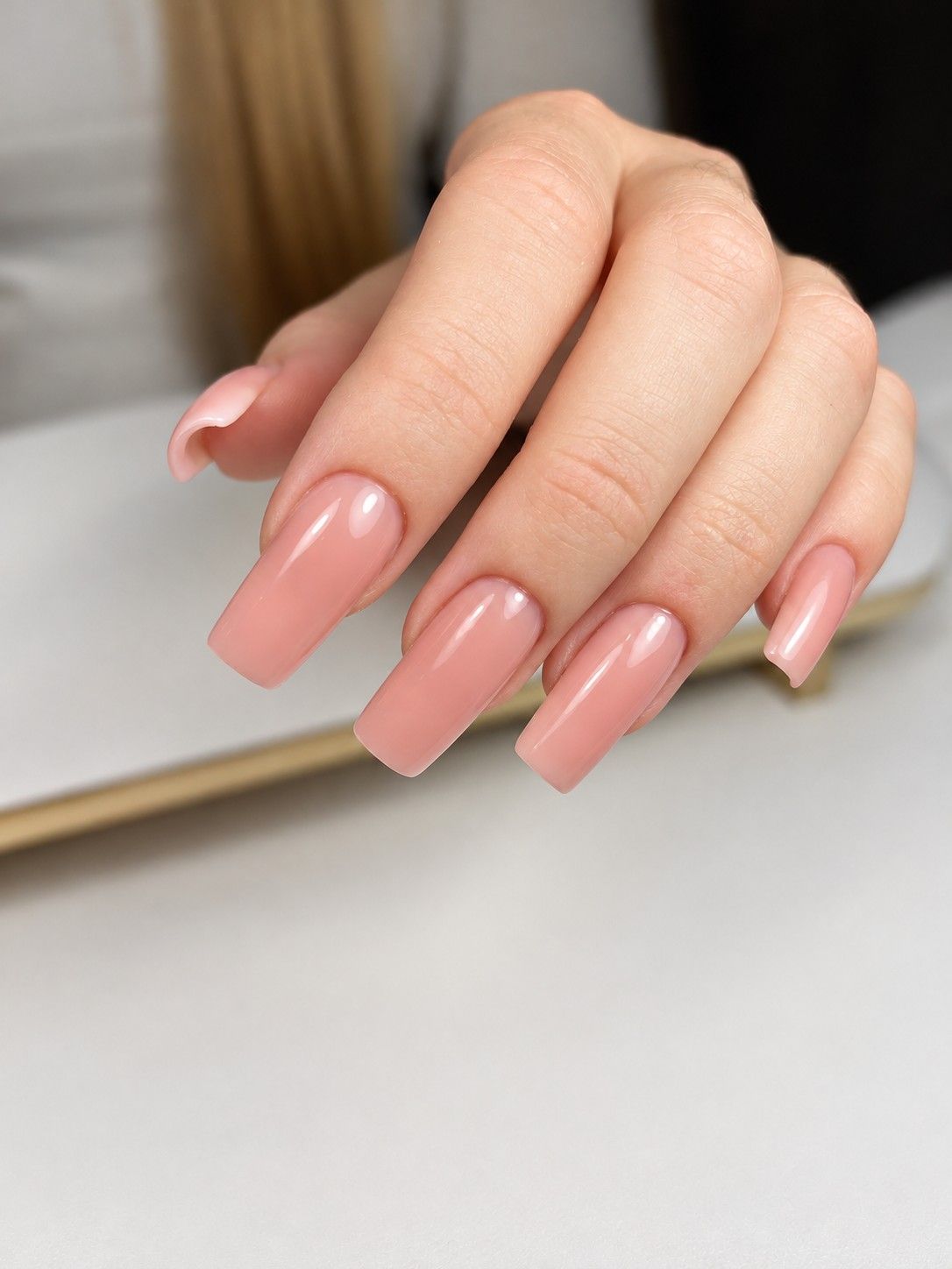 Glossy nude pink coffin manicure at Total Wrapture Medi Spa