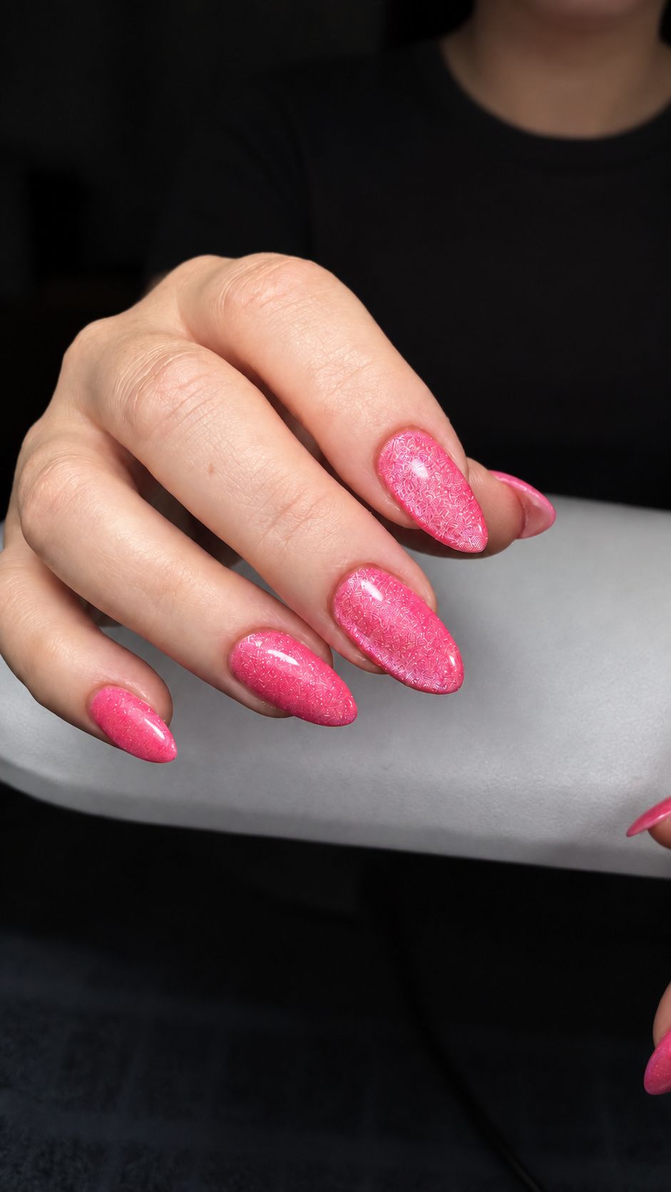 Bright pink glitter almond nails at Total Wrapture Medi Spa